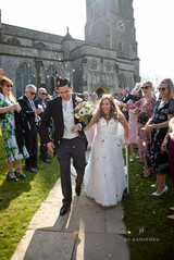 leaving the church with all their friends and family lining the path.