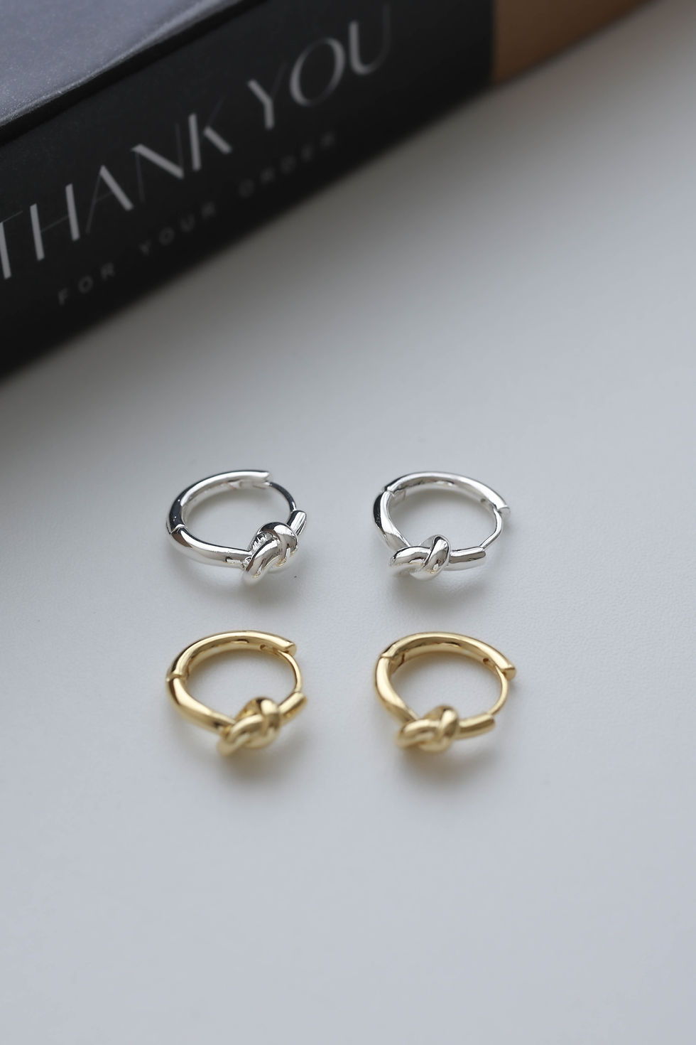 Thumbnail: Knot Hug Hoops in silver