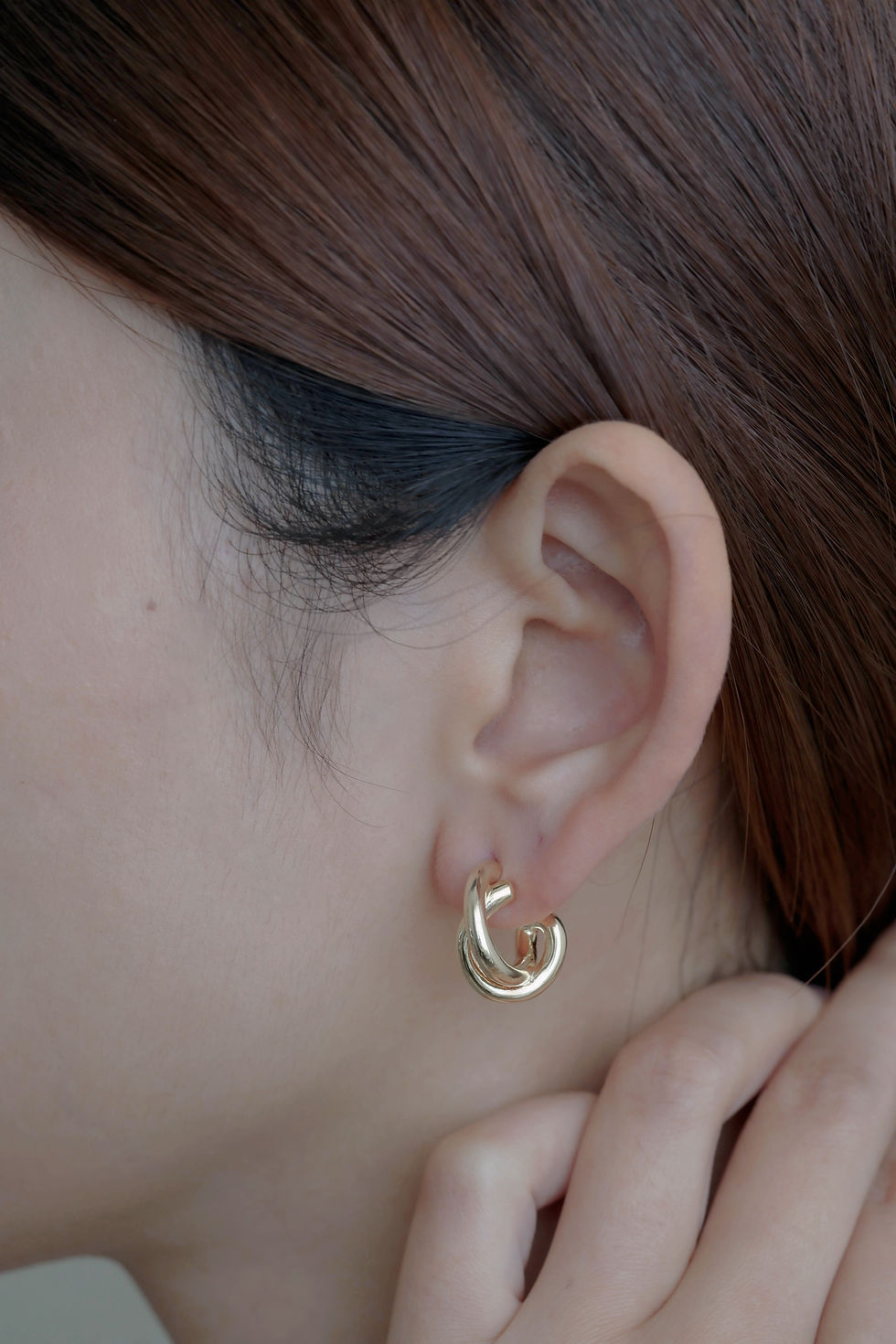 Thumbnail: Twist Knot Earrings in gold