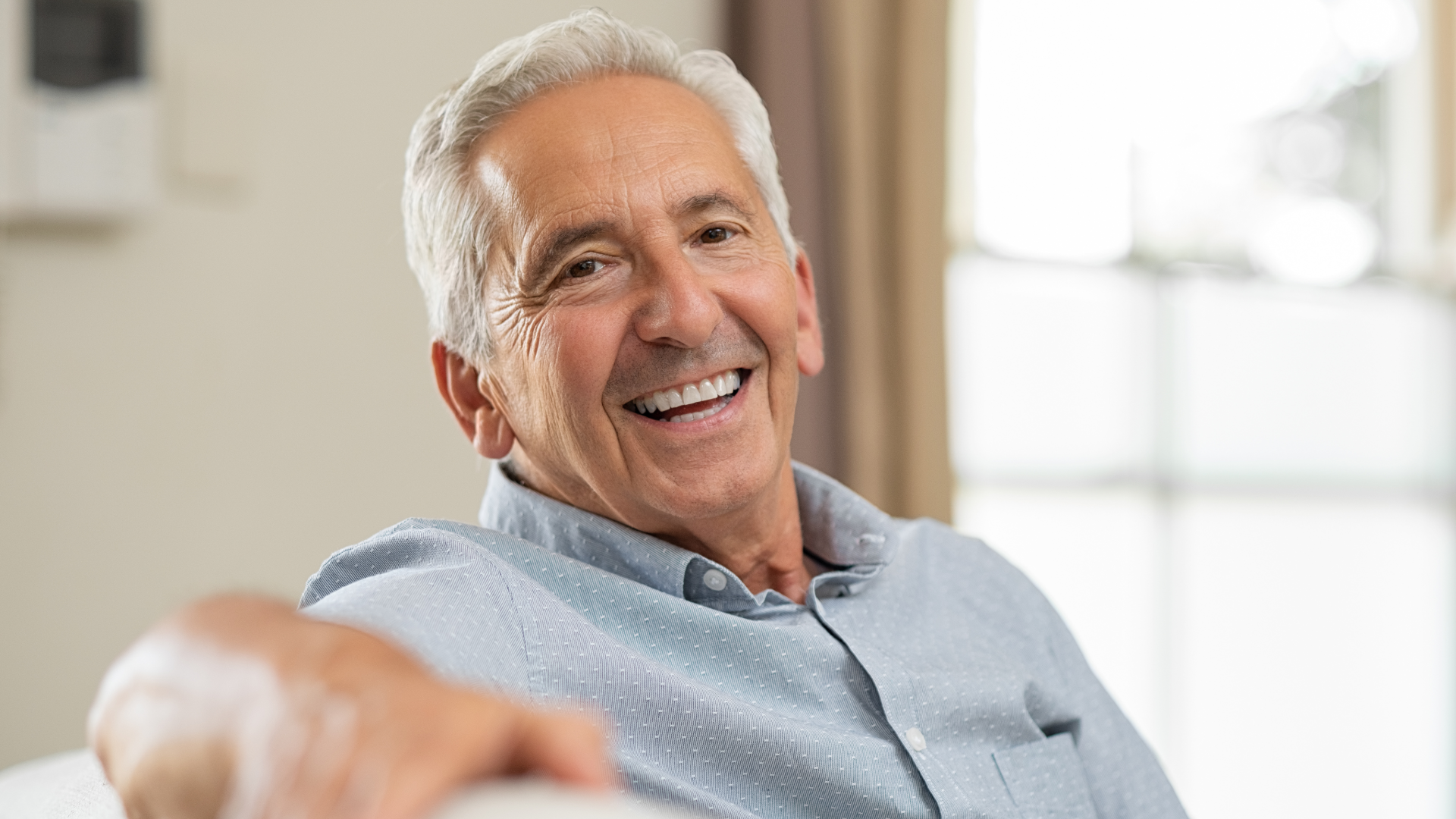 Middle-aged man relaxing comfortably during Emsella Chair treatment for male urinary incontinence and pelvic floor strengthening at Pelvic Revival, Red Deer
