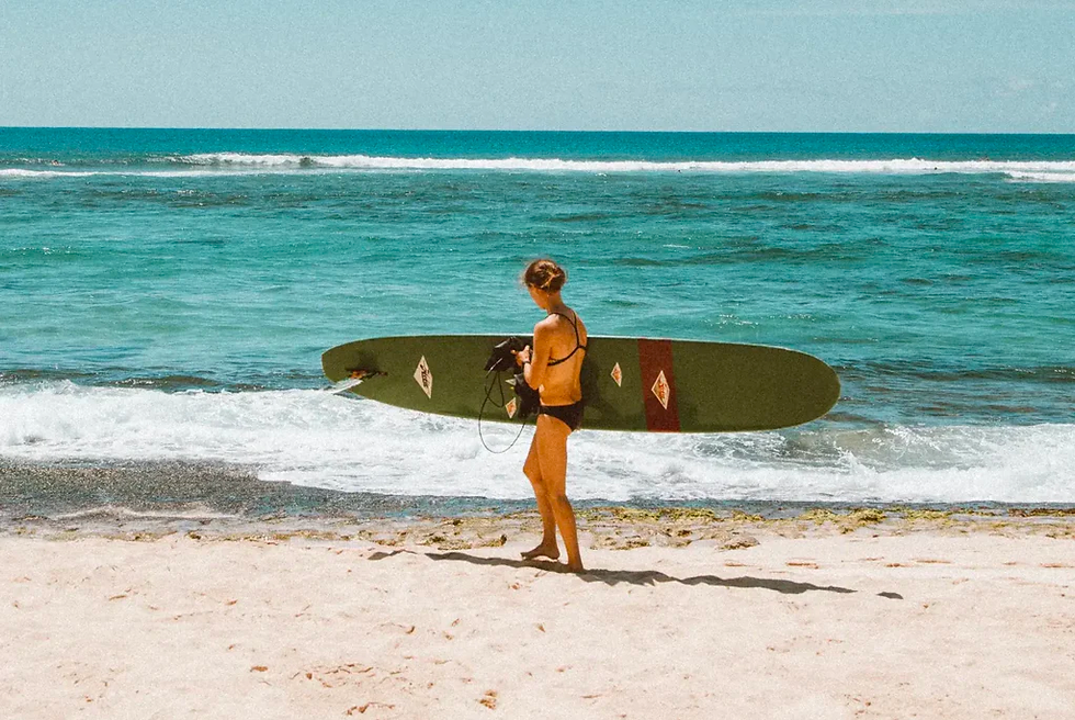 an experienced surfer ready to go out into the ocean