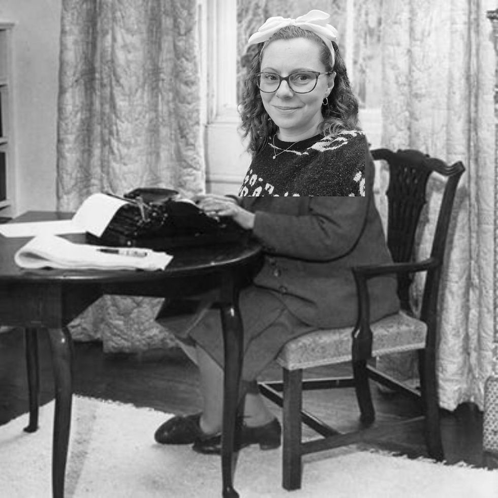 An old photograph of a woman sitting at a typewriter, in black and white. Lisa's head has been photoshopped onto the body so it appears she's typing.