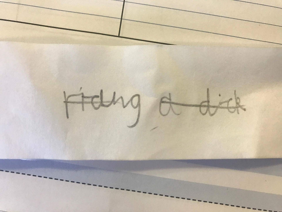 Slip of white paper with child's cursive writing that says riding a dick
