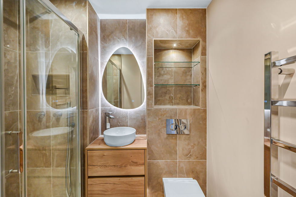 Refurbished bathroom with luxury finishes, custom fittings, and contemporary design.
