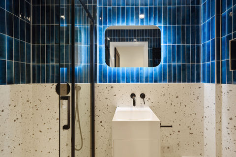 Luxury bathroom refurbishment with modern tiling and bespoke finishes by Collective Projects London, CPL.