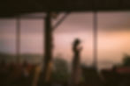 Guest enjoying a drink and panoramic sunset views over the jungle and valley at Munduk Spices Restaurant.