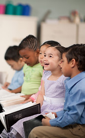 Diverse children reading in class
