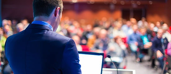 Person presenting to an audience 