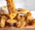 CRISPY CRISPERS - DIPPING WITH HAND.jpg