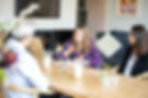 Work/life coach and consultant, Jessica Cooper, with clients in office environment