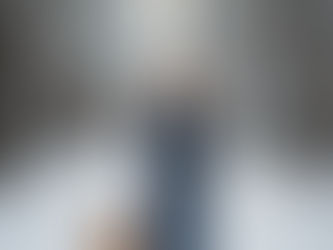 Woman walking dog on snowy trail