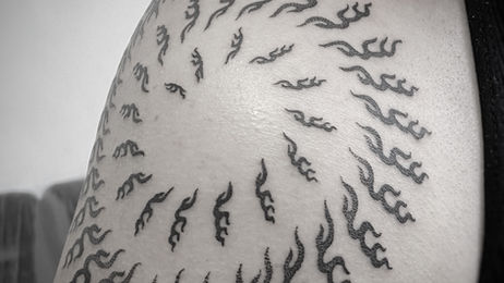 Geometric spiral tattoo