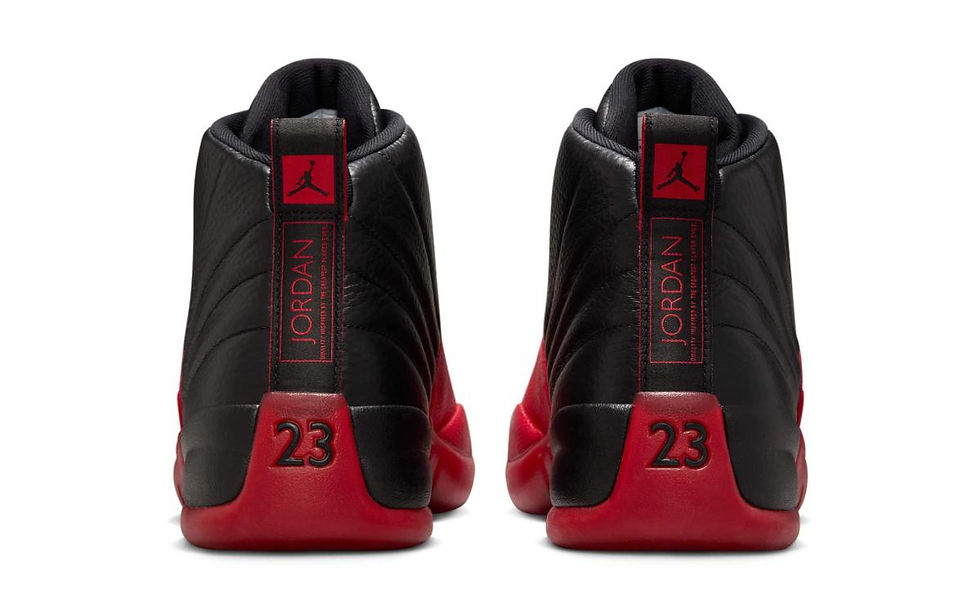 The iconic Jordan 12 Retro Flu Game 2025 model showcases its classic black and red colorway, highlighting the distinctive Jumpman logo and the number 23 on the red heel.