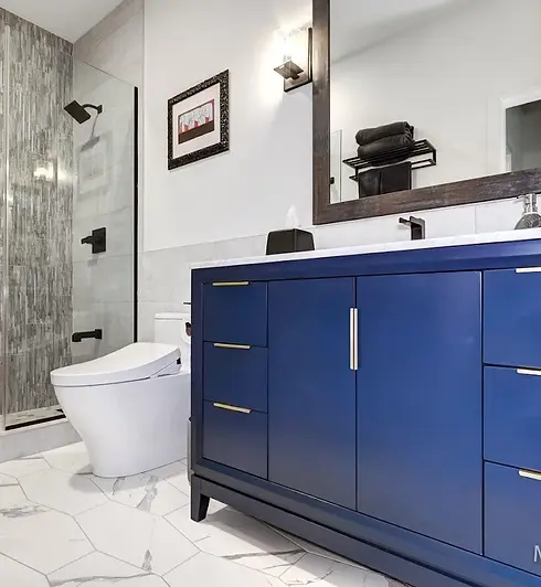 SW Portland bathroom remodel featuring custom vanity, quartz contertops, tile flooring, fully tiled walk in shower with sower glass, new fixtures and lighting