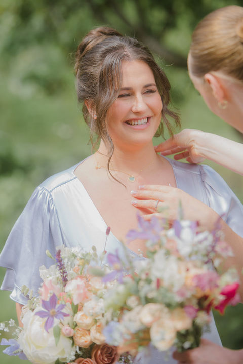 Bridesmaid with bouquet at Boreland Loch Tay