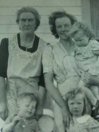 Jeannette holding dau Judy with dau Cora