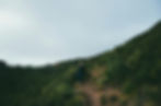 A girl hiking on a mountain trail