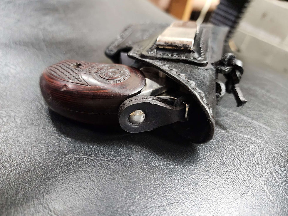Thumbnail: Custom OWB holster for Bond arms with initials, metal clip, and hammer thong.