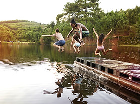 Kids Jumping into the Lake