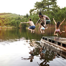 Kids Jumping into the Lake
