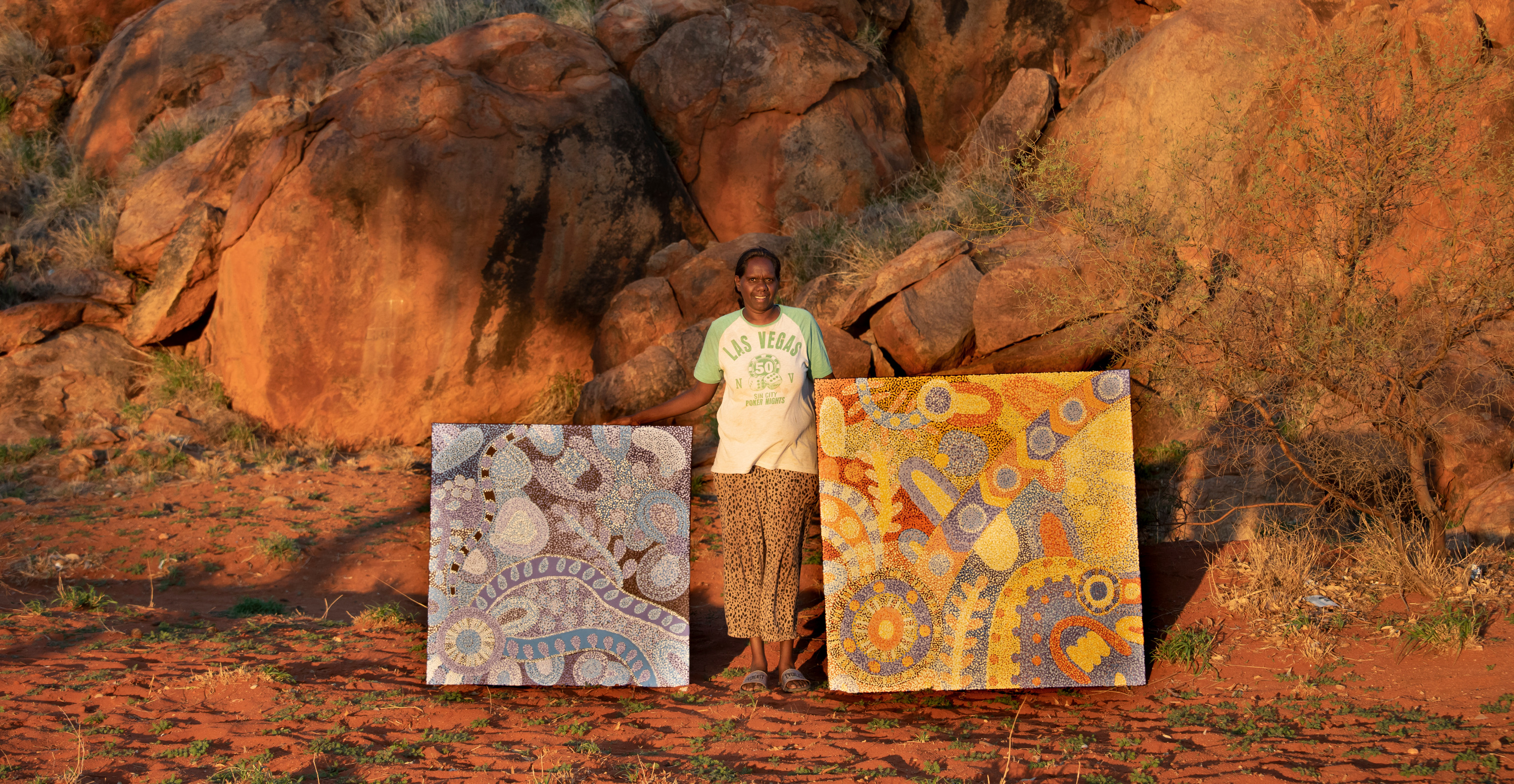 Josina Pumani with her paintings in Mimili Community, photo: Meg Hansen