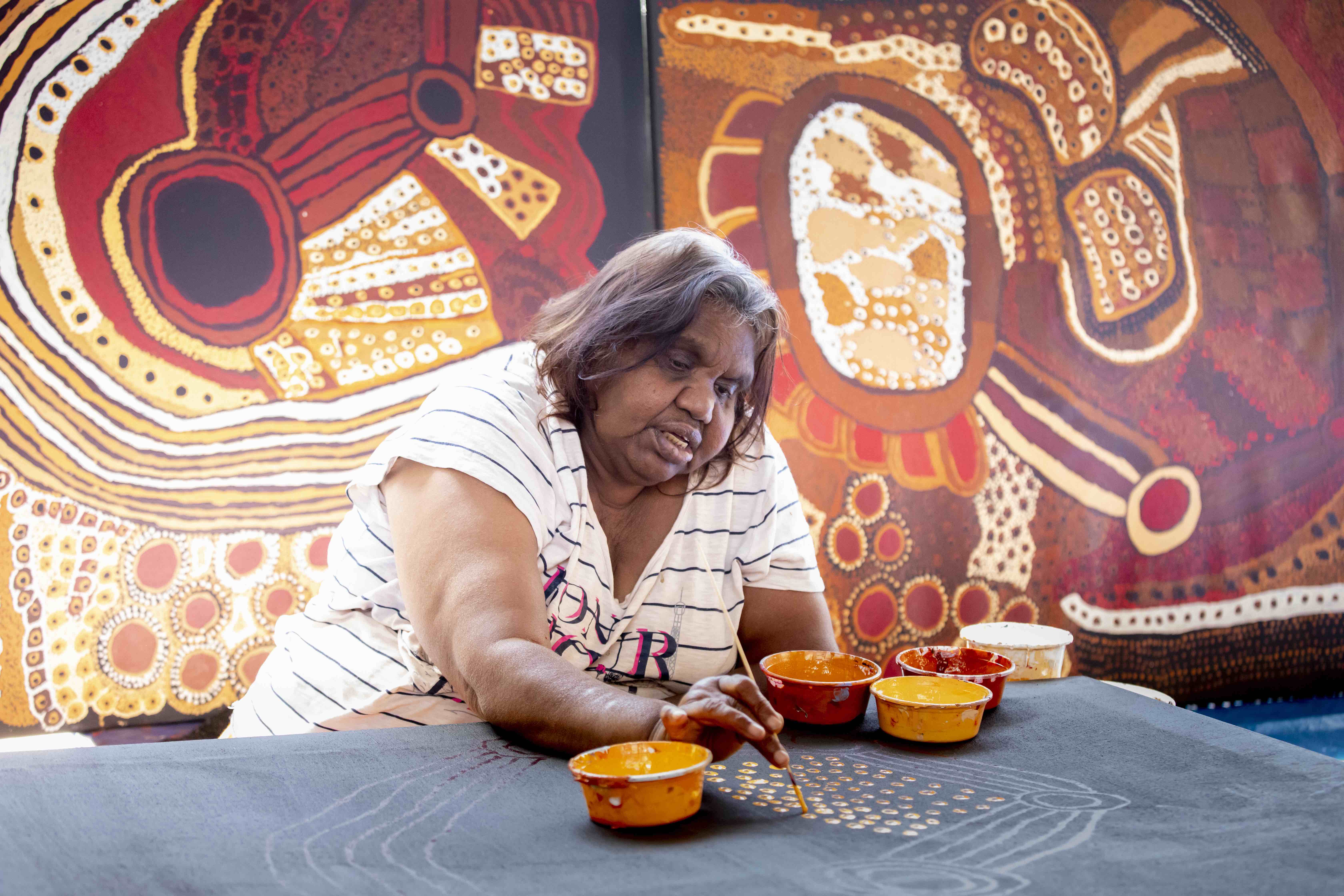 Judy Martin working on new paintings in the Mimili Maku studio, photo: Meg Hansen