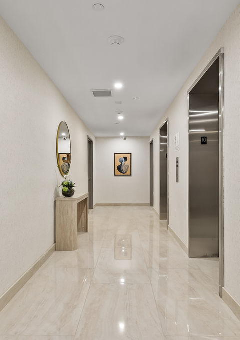 Elevator lobby and hallway inside The Prince condominium building in Flushing, Queens