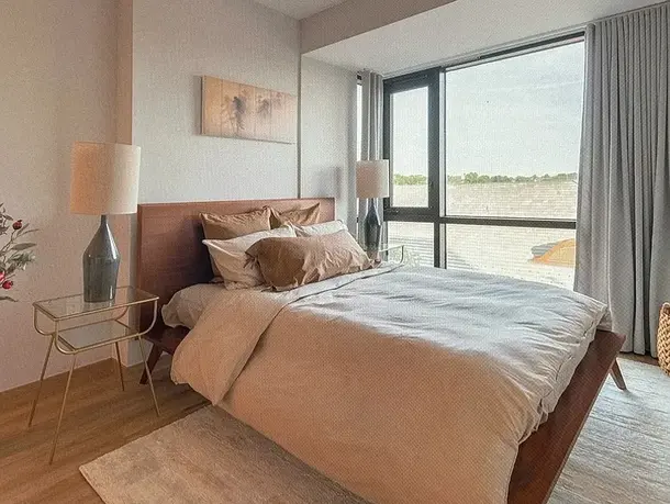 Primary bedroom with large window at 131-11 Fowler Avenue #F in Flushing