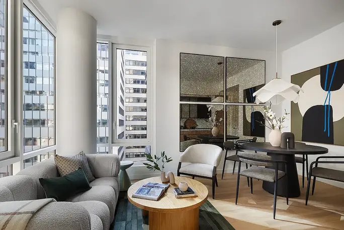 Living and dining area at 135 East 47th Street #8D rental apartment