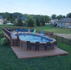 above ground pool deck with seating area