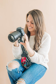 photographer looking at her camera