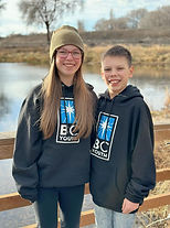 two young teenagers with black sweatshirts that say BC Youth on the front