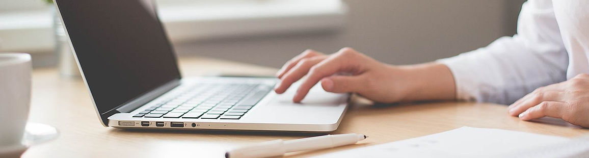 laptop desk hands typing