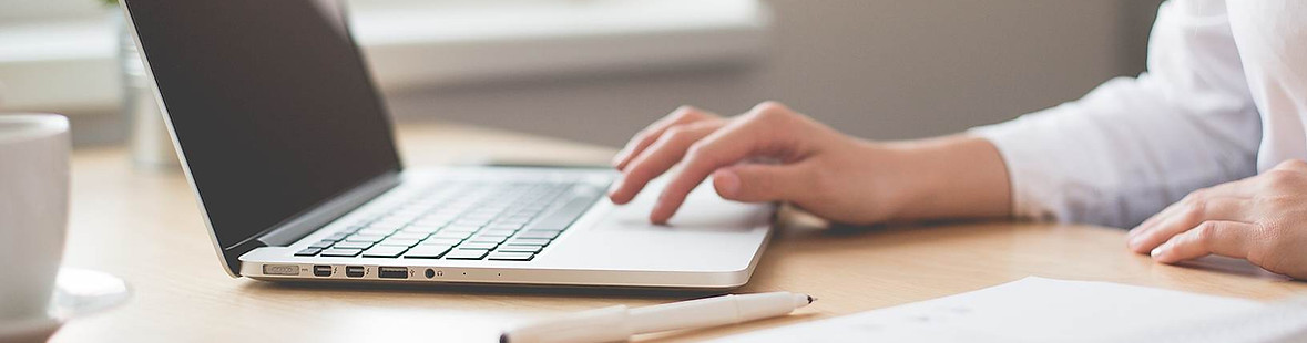 laptop desk hands typing