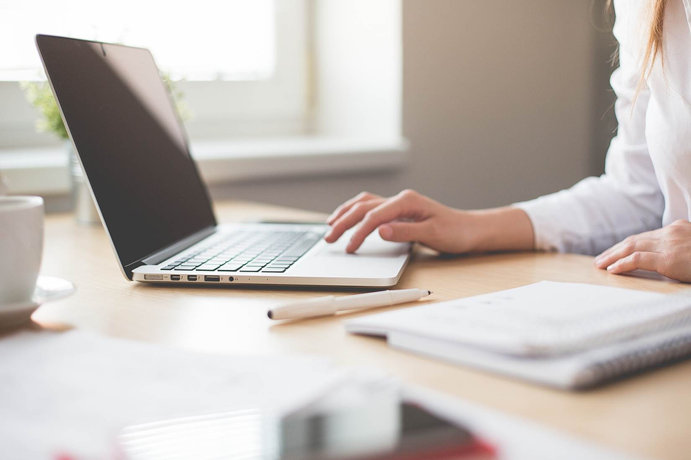 Person on a computer, immigration law, Jarbath Pena lawyers, Miami, FlL.