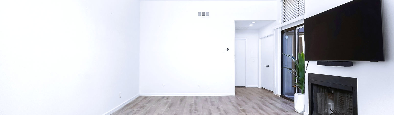TV wall mounting service in NYC with clean cable management and modern interior setup