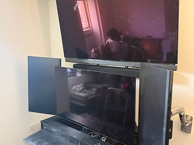 Clean TV installation with precise leveling and modern setup