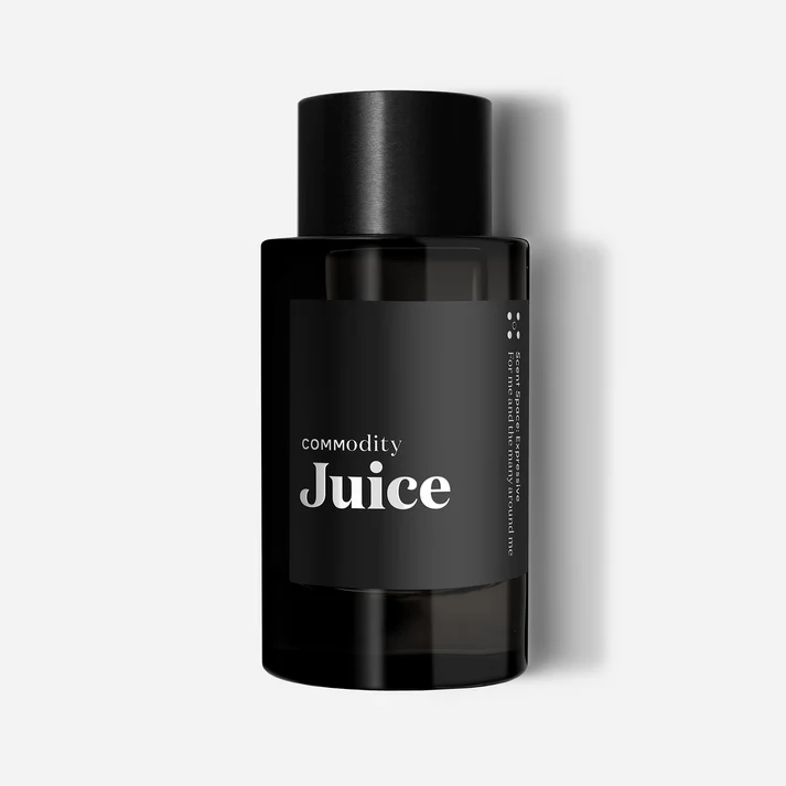 Commodity Juice perfume bottle featuring strawberry, rhubarb and raspberry notes with amberwood base, celebrating first anniversary