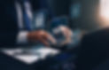 Businessman using the laptop to fill in the income tax online return form for payment. Fi