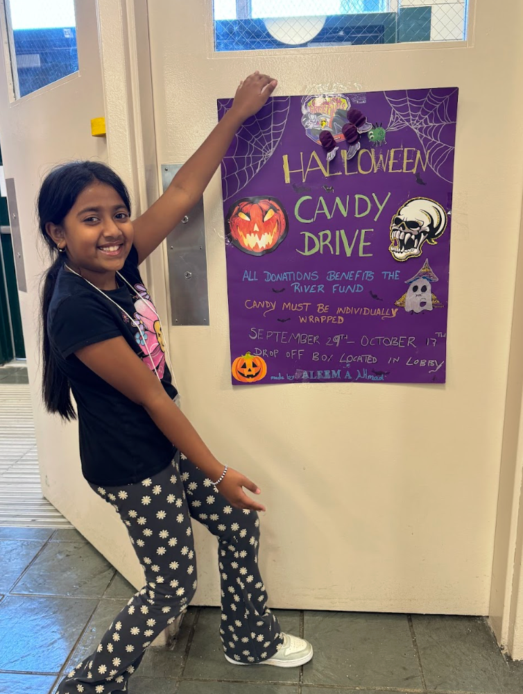 4th Graders Spencer and Tyler Armoogam & Aleema Ahmad proudly display the box and poster they each created to support our Halloween Candy Drive.  All donated candy goes to The River Fund.