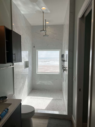Walk-in shower remodel with ocean view window — South Padre Island TX