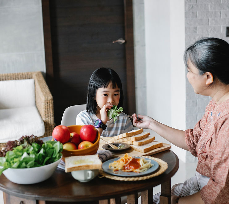Young Girl Eating Salad