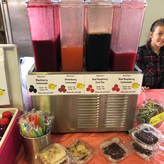 Beverage dispensers with various juices, Strawberry, Blackberry, and Blue Raspberry Lemonade.