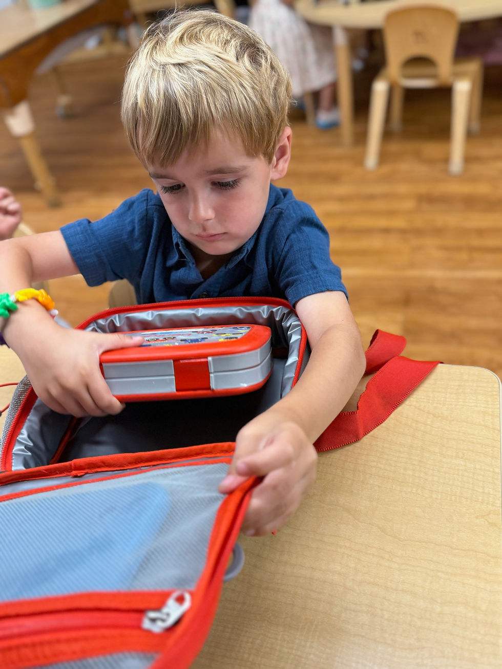 small boy packing up at lcds