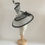 Thumbnail: Black and White -Ascot spiral hat in black and white sinamay on a white button