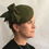 Thumbnail: Sarah - Green felt headpiece on a button base with green felt bow
