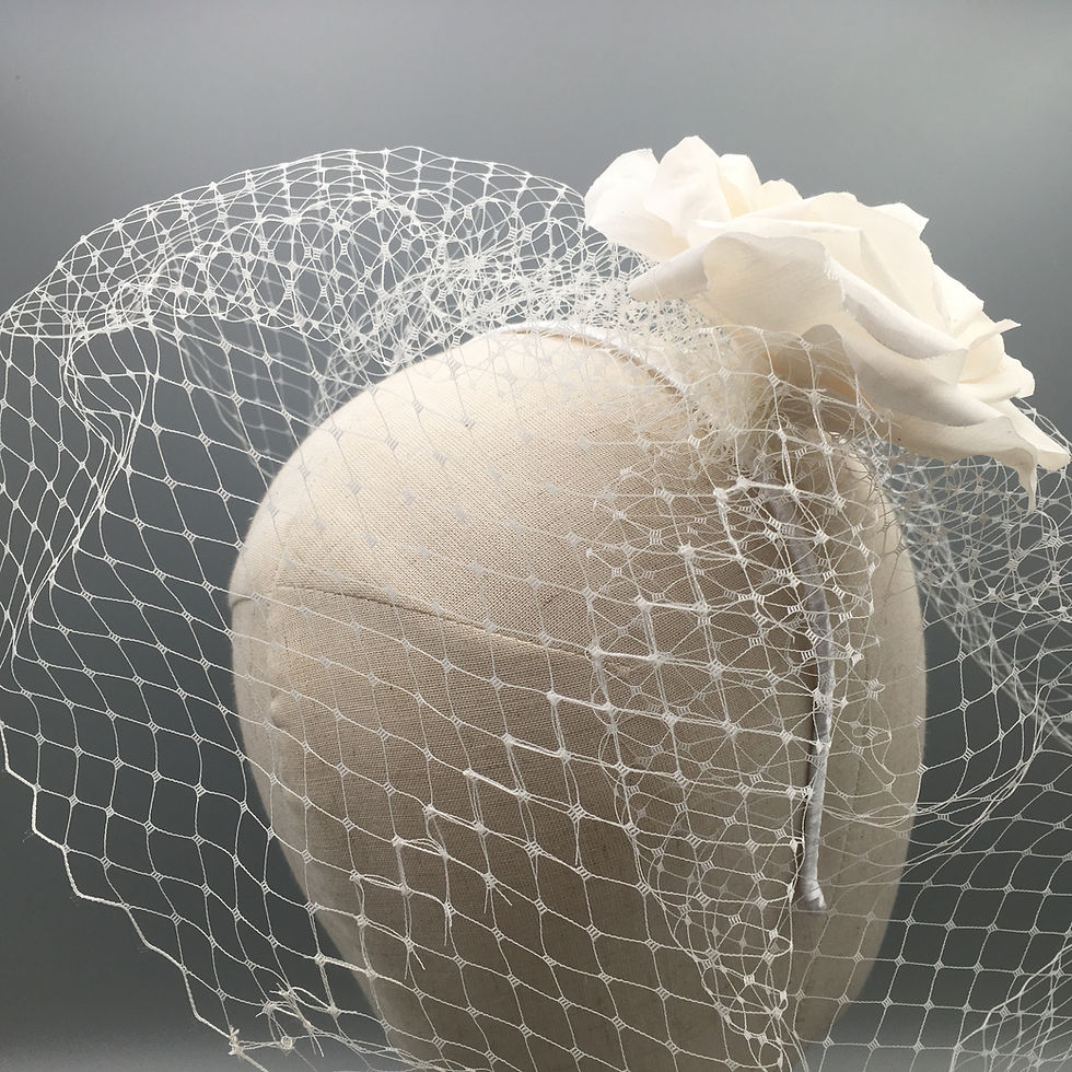 Thumbnail: Claudia - White handmade silk flower on a headband with birdcage veil