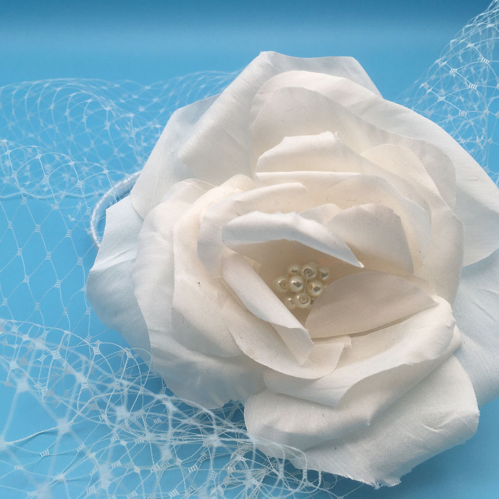 Thumbnail: Claudia - White handmade silk flower on a headband with birdcage veil