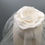 Thumbnail: Roberta - White lace and silk button headpiece with a shoulder length veil