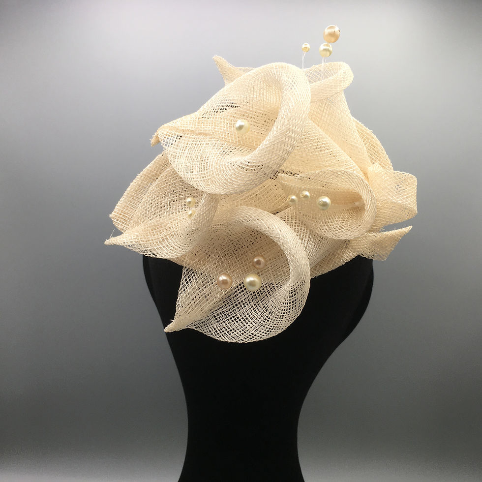 Thumbnail: Eva - Fascinator with 5 cream sinamay lilies on a sinamay base with a comb